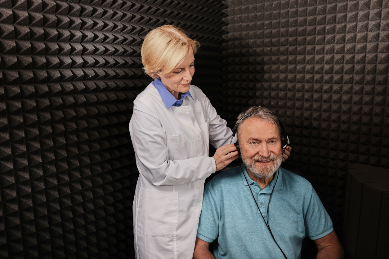 Senior man getting ready to take a hearing test